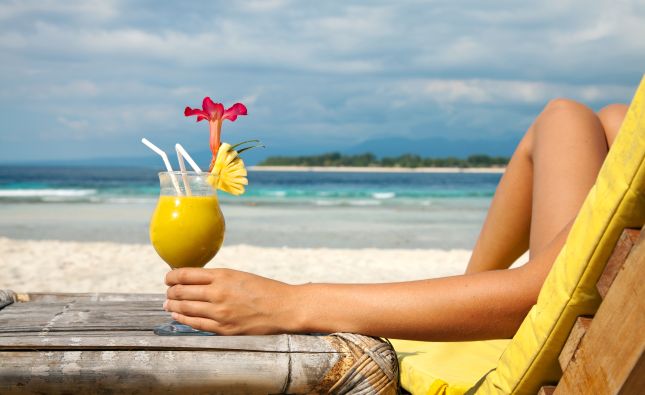 Lady relaxing on the beach in the Bahamas